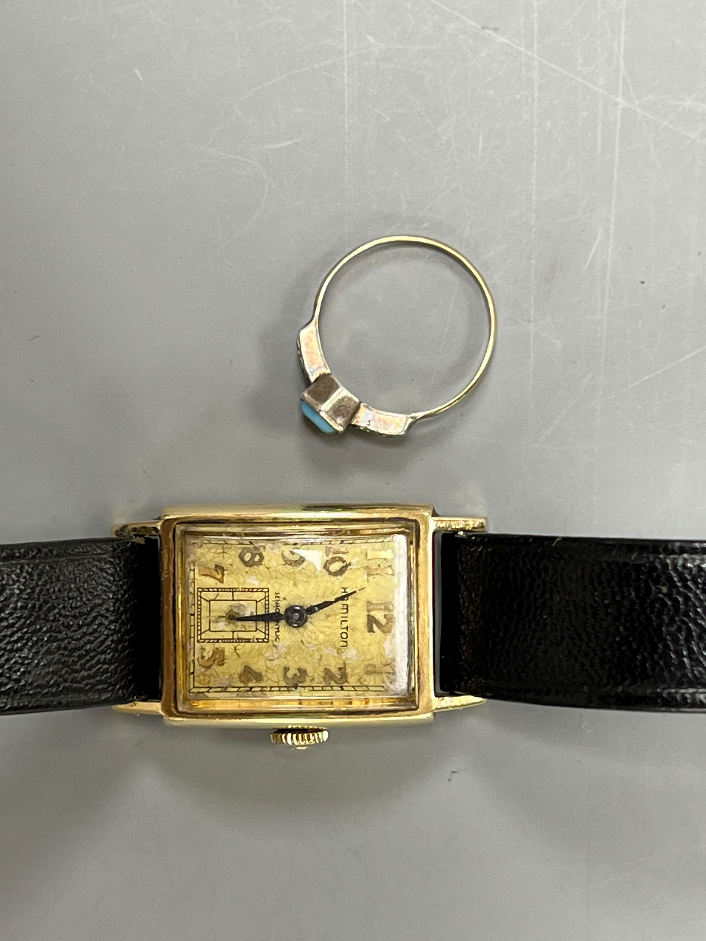 A gentleman's 10k yellow metal Hamilton manual wind wrist watch and a 9ct and white metal ring.